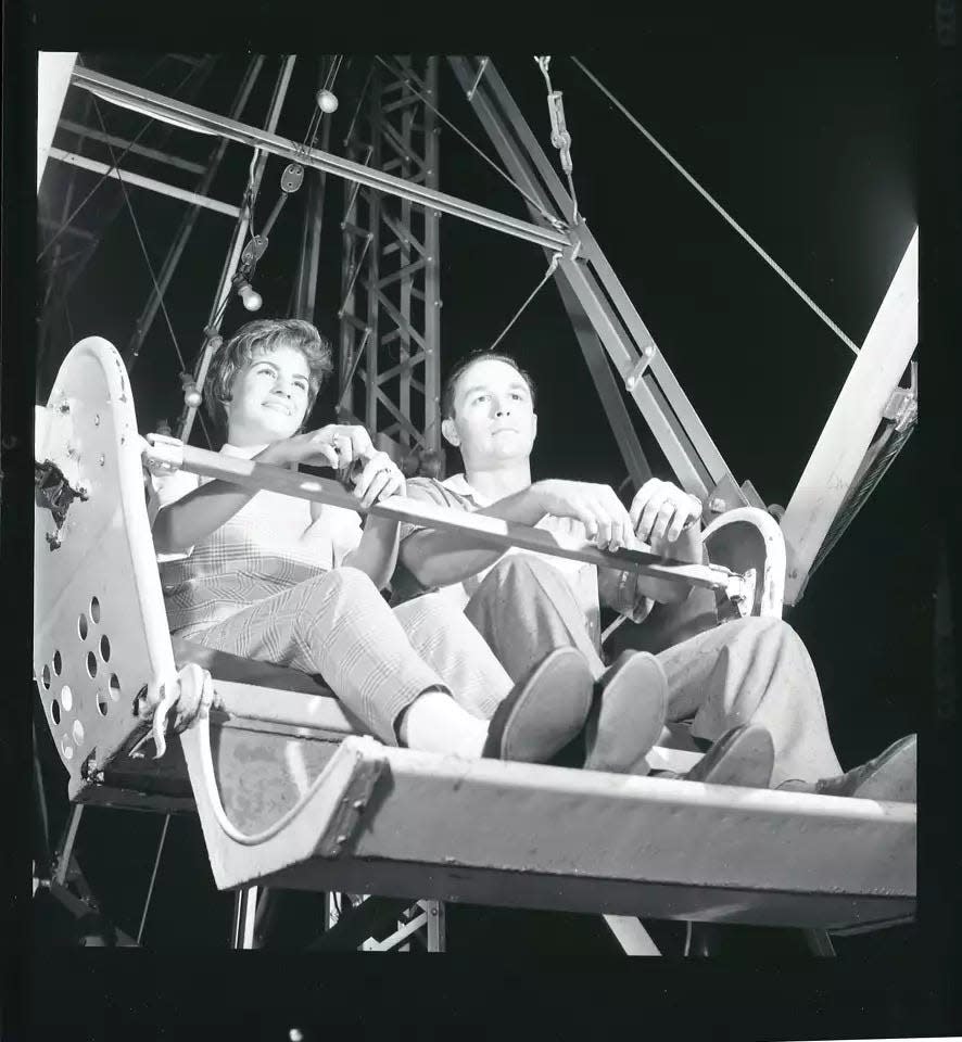 Ferris wheel riders at Playland Park in Houston in August 1961.