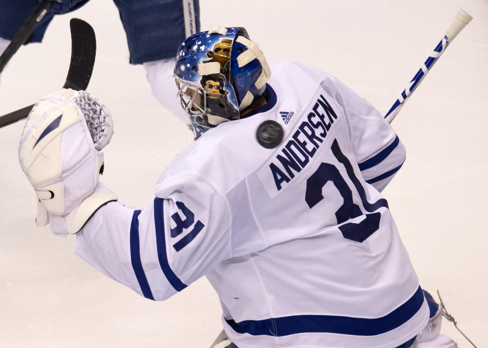 The puck goes past Toronto Maple Leafs goaltender Frederik Andersen (31) for a goal by Columbus Blue Jackets defenseman Vladislav Gavrikov (not shown) during the second period of an NHL hockey playoff game Friday, Aug. 7, 2020, in Toronto. (Frank Gunn/The Canadian Press via AP)