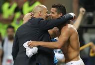 Soccer Football - Atletico Madrid v Real Madrid - UEFA Champions League Final - San Siro Stadium, Milan, Italy - 28/5/16 Real Madrid's Cristiano Ronaldo celebrates with coach Zinedine Zidane after winning the penalty shootout and the UEFA Champions League Final Action Images via Reuters / Carl Recine