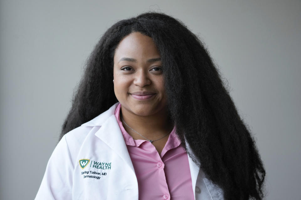 Dr. Starling Tolliver, a dermatology resident at Wayne State University poses at Wayne Health in Dearborn, Mich., Tuesday, Aug. 1, 2023. (AP Photo/Paul Sancya)