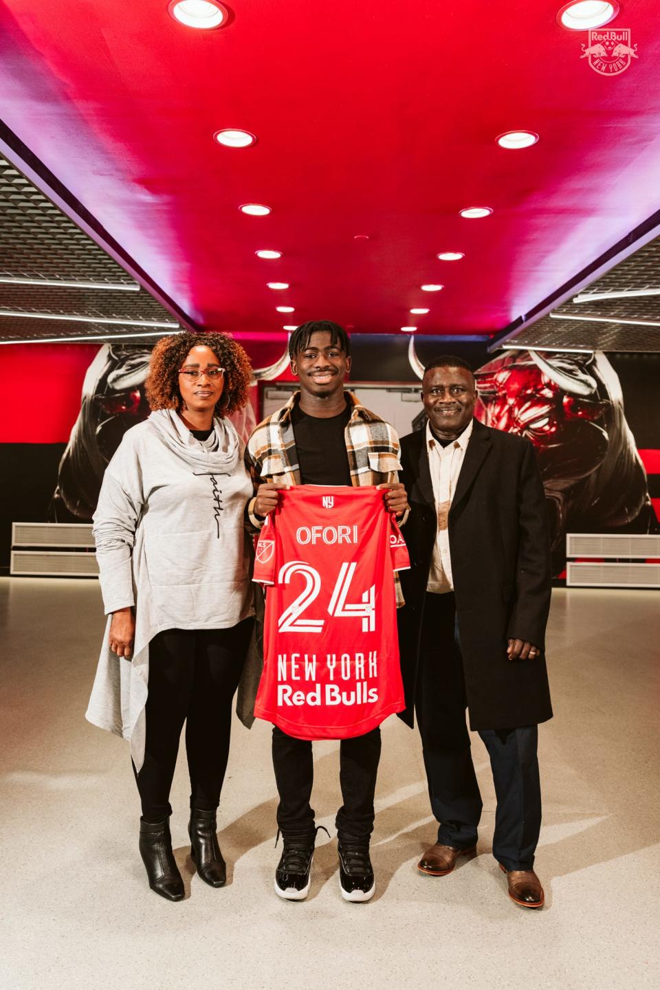 Wappingers Falls' Curtis Ofori, flanked by his parents Gladys and Willberforce, pose after the 17-year-old signed with the New York Red Bulls in December.