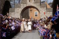 <p>Queen Elizabeth II and Rt Rev John Denis Wakeling, the Bishop of Southwell, enter Southwell Minster amid cheering crowds. (PA Archive) </p>