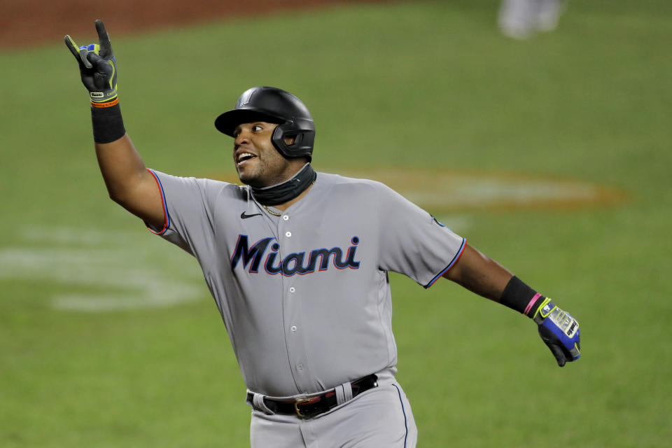 Miami Marlins' Jesus Aguilar reacts after hitting a solo home run off Baltimore Orioles starting pitcher Tom Eshelman during the eighth inning of a baseball game, Tuesday, Aug. 4, 2020, in Baltimore. (AP Photo/Julio Cortez)