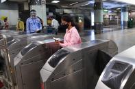 A commuter arrives in a metro station after Delhi Metro Rail Corporation (DMRC) resumed services in New Delhi on September 7, 2020. (Photo by PRAKASH SINGH/AFP via Getty Images)