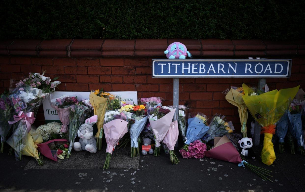 Tributes to the victims are left by wellwishers