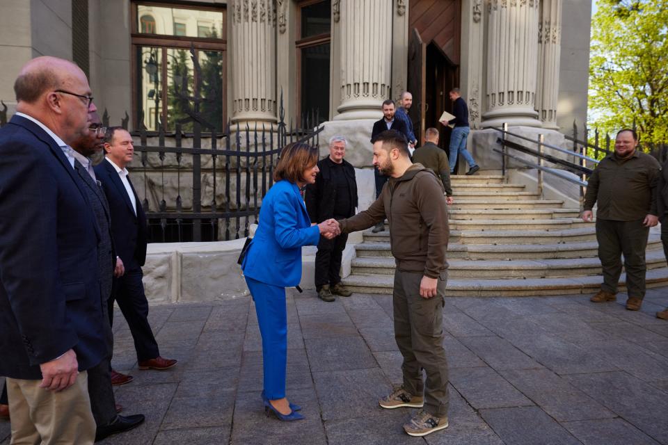 A handout photo released by the Ukrainian Presidential Press Service on May 1, 2022, shows President of Ukraine Volodymyr Zelensky welcoming Speaker of the House of Representatives of the United States Congress Nancy Pelosi during their meeting in Kyiv. 