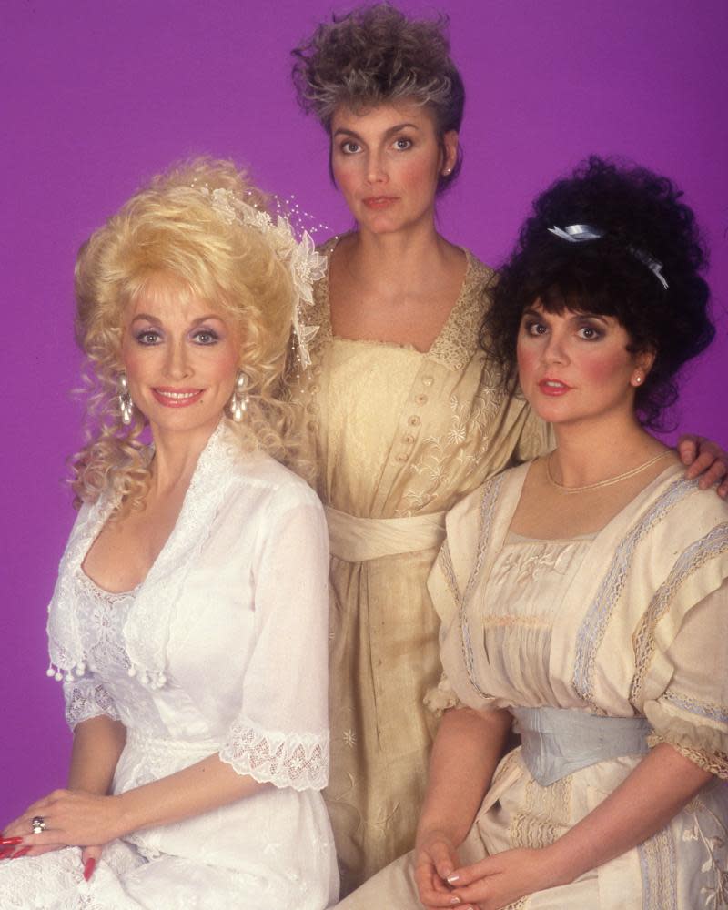 ‘I could call up Emmylou Harris and we would sing together over the phone.’ Dolly Parton, Emmylou Harris and Ronstadt in 1987.