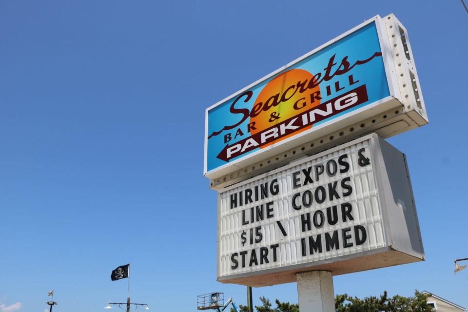 Seacrets Bar & Grill advertises its open positions on its marquee sign along Coastal Highway in Ocean City on June 30, 2020. Seacrets is just one example of Ocean City businesses doing whatever they can to fill vacant positions.