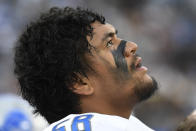 Detroit Lions offensive tackle Penei Sewell reacts on the sidelines during the second half of an NFL football game against the Los Angeles Rams Sunday, Oct. 24, 2021, in Inglewood, Calif. (AP Photo/Kevork Djansezian)