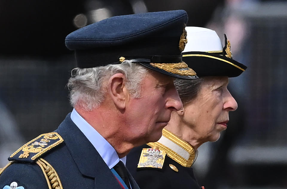 LONDON, ENGLAND - SEPTEMBER 14:  King Charles III, and Princess Anne, Princess Royal walk behind Queen Elizabeth II's coffin from Buckingham Palace to the Palace of Westminster on September 14, 2022 in London, United Kingdom. Queen Elizabeth II's coffin is taken in procession on a Gun Carriage of The King's Troop Royal Horse Artillery from Buckingham Palace to Westminster Hall where she will lay in state until the early morning of her funeral. Queen Elizabeth II died at Balmoral Castle in Scotland on September 8, 2022, and is succeeded by her eldest son, King Charles III. (Photo by Justin Tallis - WPA Pool/Getty Images)