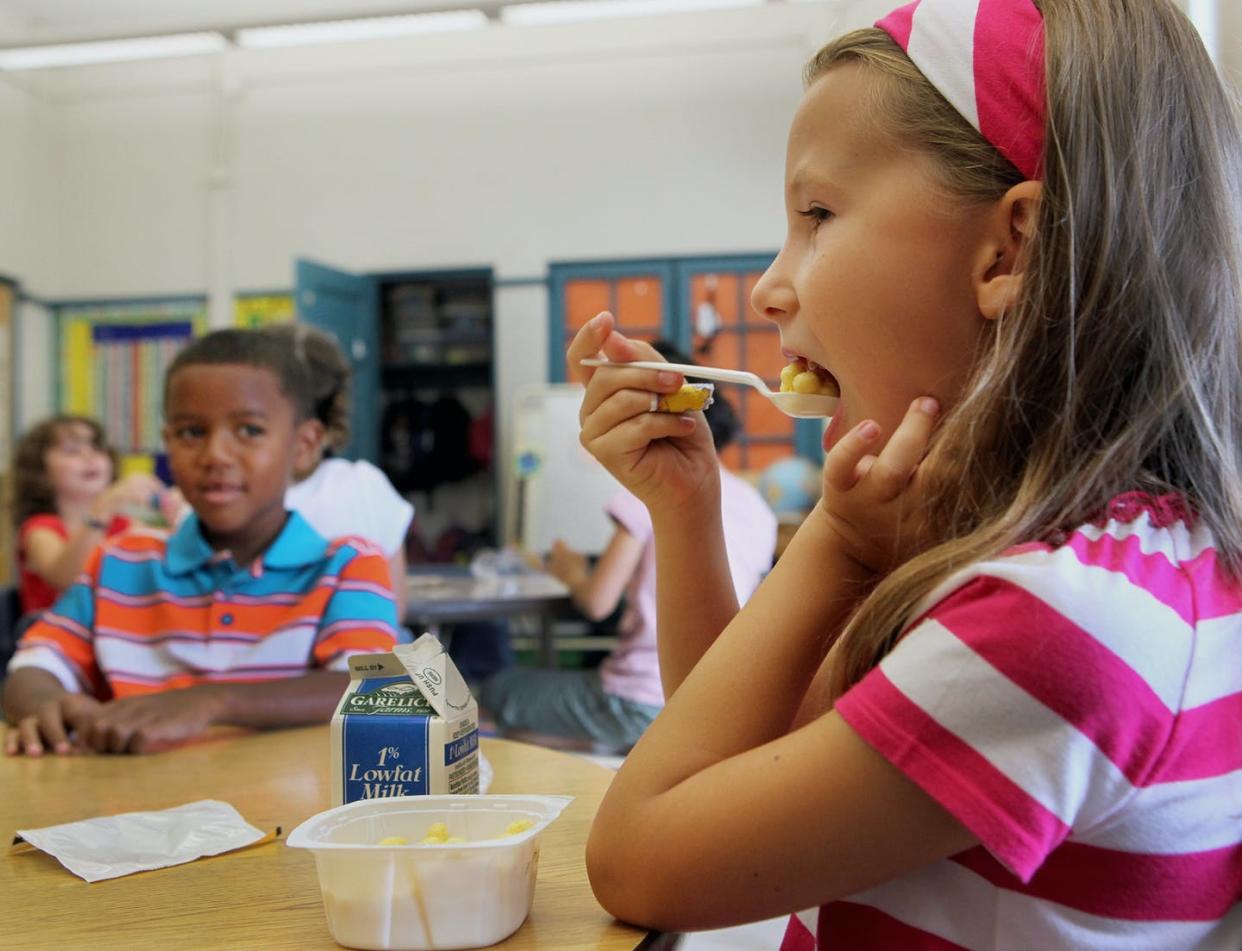 <span class="caption">When schools make free meals more accessible, families can save money on groceries.</span> <span class="attribution"><a class="link " href="https://www.gettyimages.com/detail/news-photo/as-part-of-boston-public-schools-free-offerings-of-news-photo/154676593?adppopup=true" rel="nofollow noopener" target="_blank" data-ylk="slk:Wendy Maeda/The Boston Globe via Getty Images;elm:context_link;itc:0;sec:content-canvas">Wendy Maeda/The Boston Globe via Getty Images</a></span>