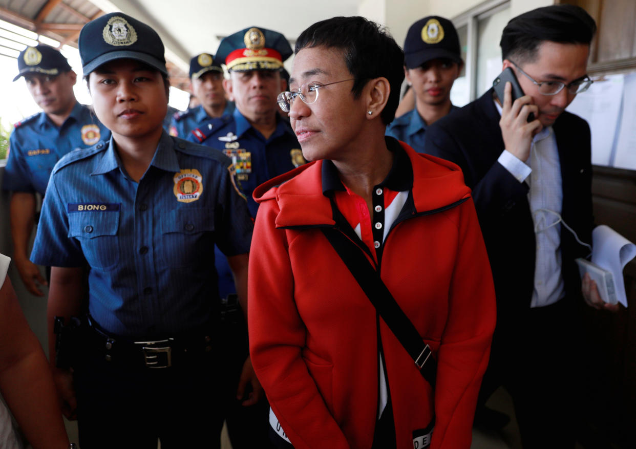 Rappler CEO and Executive Editor Maria Ressa is escorted by police after posting bail in Pasig Regional Trial Court in Pasig City, Philippines, March 29, 2019. REUTERS/Eloisa Lopez