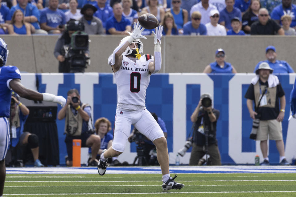 Ball State wide receiver Nick Munson (0) goes up for the ball during the first half of an NCAA college football game against Kentucky in Lexington, Ky., Saturday, Sept. 2, 2023. (AP Photo/Michelle Haas Hutchins)