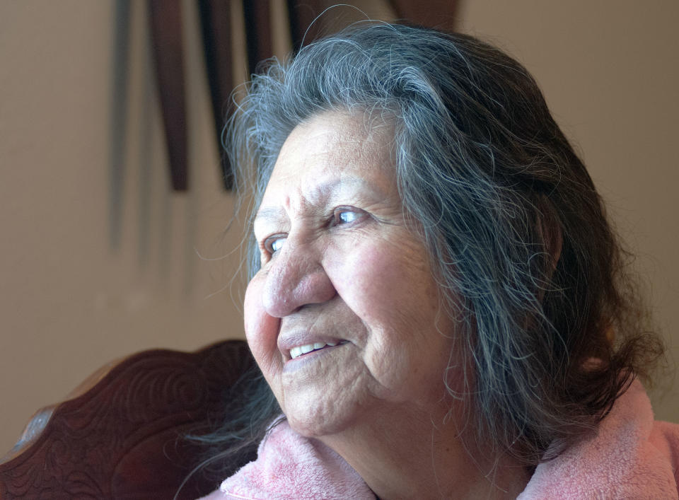 In this Thursday, Feb. 6, 2014 photo Sara Dogskin looks out a window in her Fort Yates, N.D. home as she talks about her daughter, Debbie Dogskin, who died this week while house-sitting for a friend in a rundown mobile home with an empty propane tank. A nationwide propane shortage has hit the Standing Rock Reservation American Indian reservation particularly hard. (AP Photo/Kevin Cederstrom)