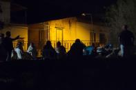 <p>People gather and wait in a street, early morning in Ischia, on Aug. 22, 2017, after an earthquake hit the popular Italian tourist island off the coast of Naples, causing several buildings to collapse overnight. (Photo: Eliano Imperato/AFP/Getty Images) </p>