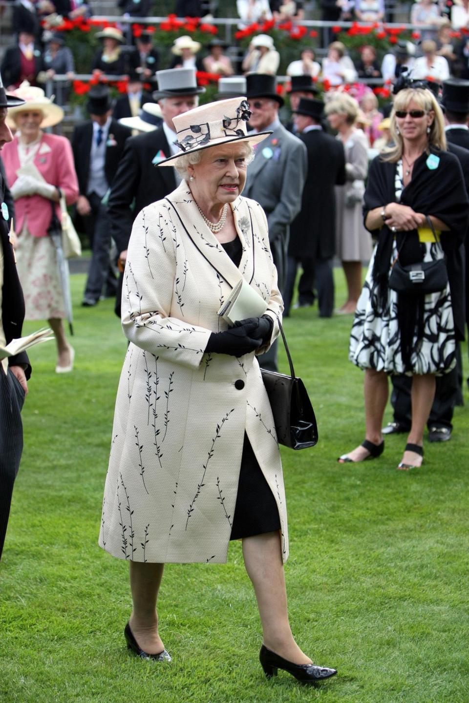 <p>The Queen walked out in a rare printed look for a day at Ascot.<br><i>[Photo: PA]</i> </p>