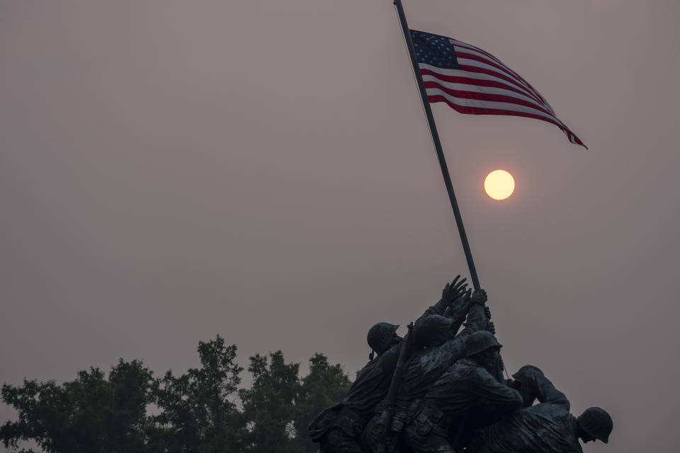 Haze blankets the United States Marine Corps War Memorial as the sun rises, Thursday, June 8, 2023, in Arlington, Va. Smoke from Canadian wildfires is pouring into the U.S. East Coast and Midwest and covering the capitals of both nations in an unhealthy haze. (AP Photo/Alex Brandon)