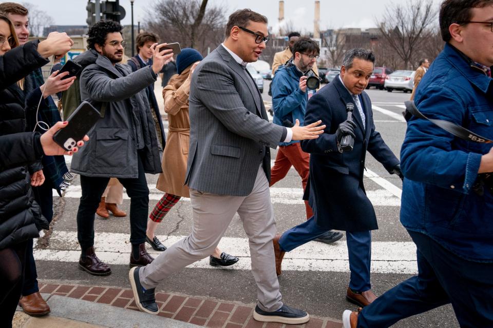 Rep. George Santos, R-N.Y., leaves a House GOP conference meeting on Capitol Hill in Washington on Wednesday.