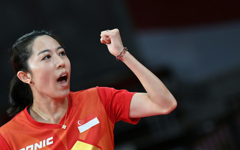 Singapore paddler Yu Meng Yu celebrates a point as she competes against France's Yuan Jia Nan in the women's team competition at the 2020 Tokyo Olympics. (PHOTO: Jung Yeon-je / AFP)