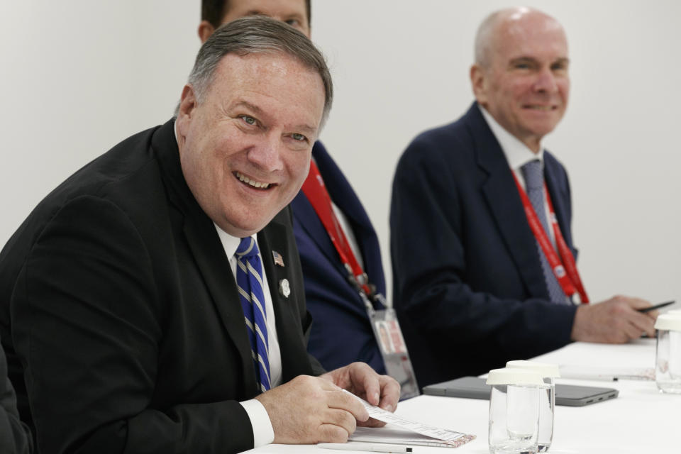 FILE - In this June 28, 2019, file photo, Secretary of State Mike Pompeo, left, sits down for a meeting with Japanese Foreign Minister Taro Kono, in Osaka, Japan, Friday, June 28, 2019, during the G-20 summit, with senior adviser Michael McKinley, right. McKinley has been asked to appear Wednesday, Oct. 16 in the House impeachment inquiry of President Donald Trump, according to several officials familiar with the planning. (AP Photo/Jacquelyn Martin, Pool, File)