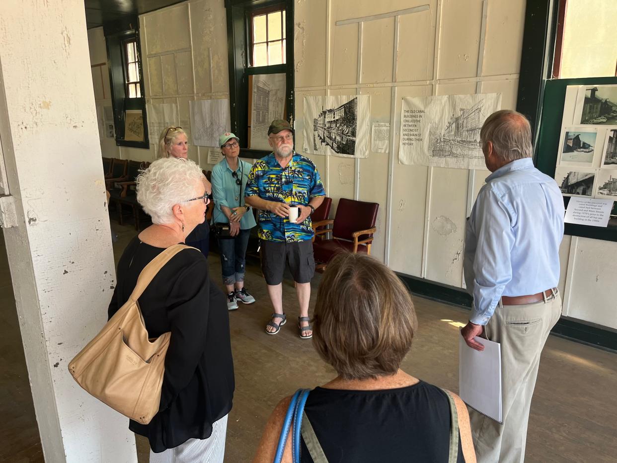 Franklin Conaway gave a tour of the Canal Warehouse to visitors during the annual Southeast Ohio History Center meeting.