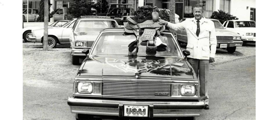 Cecil Clark shown with a car.