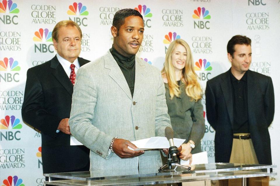 Actor Blair Underwood announces nominees for the 54th Annual Golden Globe Awards on live television, Dec. 19, 1996 in Beverly Hills. Actors Paul Sorvino, left rear, Laura Dern, center rear, and Andy Garcia, right rear, joined Underwood in the announcements. The motion picture ?The English Patient? had the most nominations, picking up seven from a variety of categories. The awards ceremony will be broadcast January 19. (AP Photo/Rene Macura)