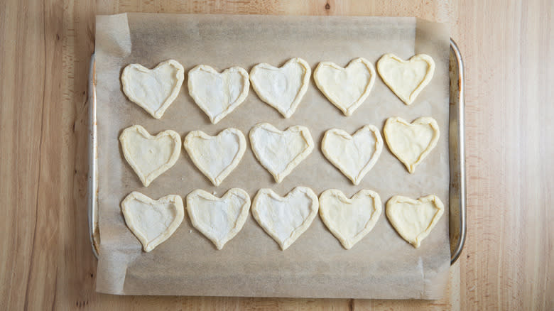 pastry hearts on baking pan 