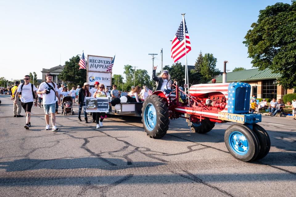 Floats are driven down Huron Avenue during the Rotary International Day Parade during Boat Week Wednesday, July 21, 2021, in Port Huron.