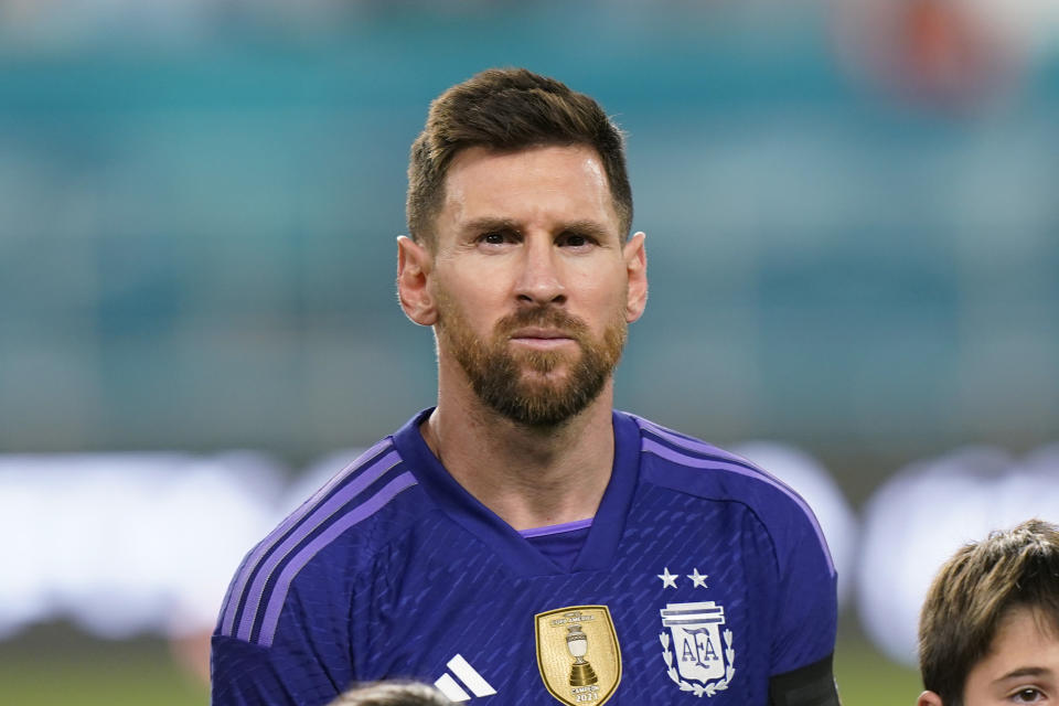 FILE - Argentina's Lionel Messi stands during the National Anthem, Friday, Sept. 23, 2022, before the start of an international friendly soccer match against Honduras in Miami Gardens, Fla. Lionel Messi says he is coming to Inter Miami and joining Major League Soccer. After months of speculation, Messi announced his decision Wednesday, June 7, 2023, to join a Miami franchise that has been led by another global soccer icon in David Beckham since its inception but has yet to make any real splashes on the field.(AP Photo/Wilfredo Lee, File)