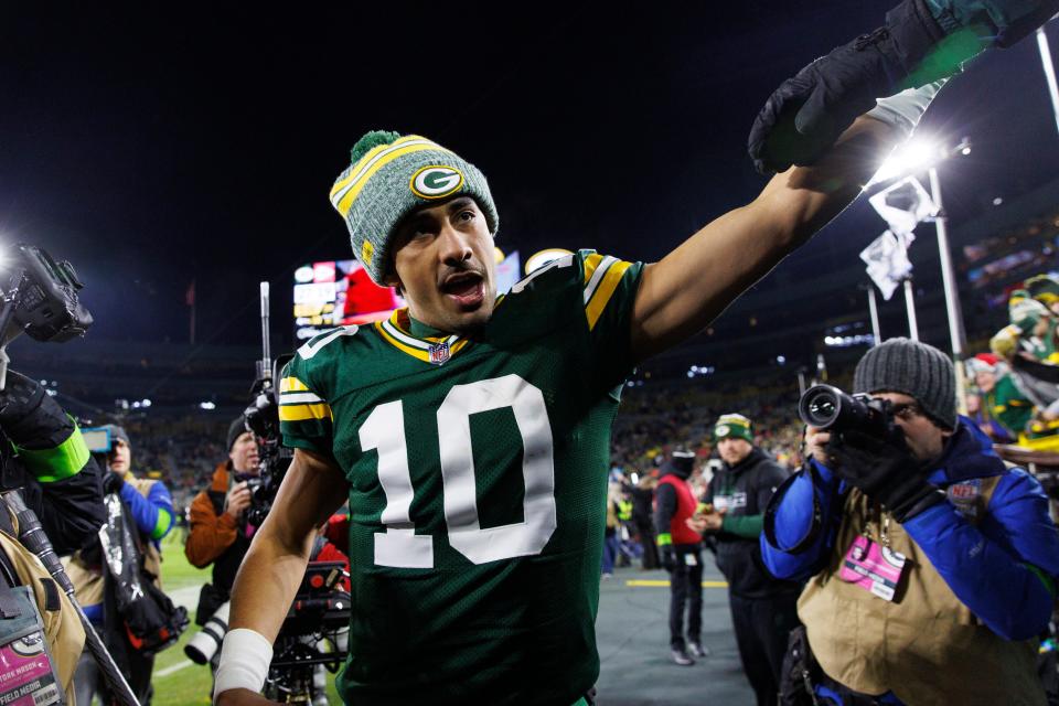 Green Bay Packers quarterback Jordan Love celebrates with fans following the game against the Kansas City Chiefs at Lambeau Field.