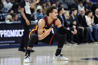 Atlanta Hawks guard Trae Young (11) reacts in the second half of an NBA basketball game against the Memphis Grizzlies, Friday, Nov. 26, 2021, in Memphis, Tenn. (AP Photo/Brandon Dill)