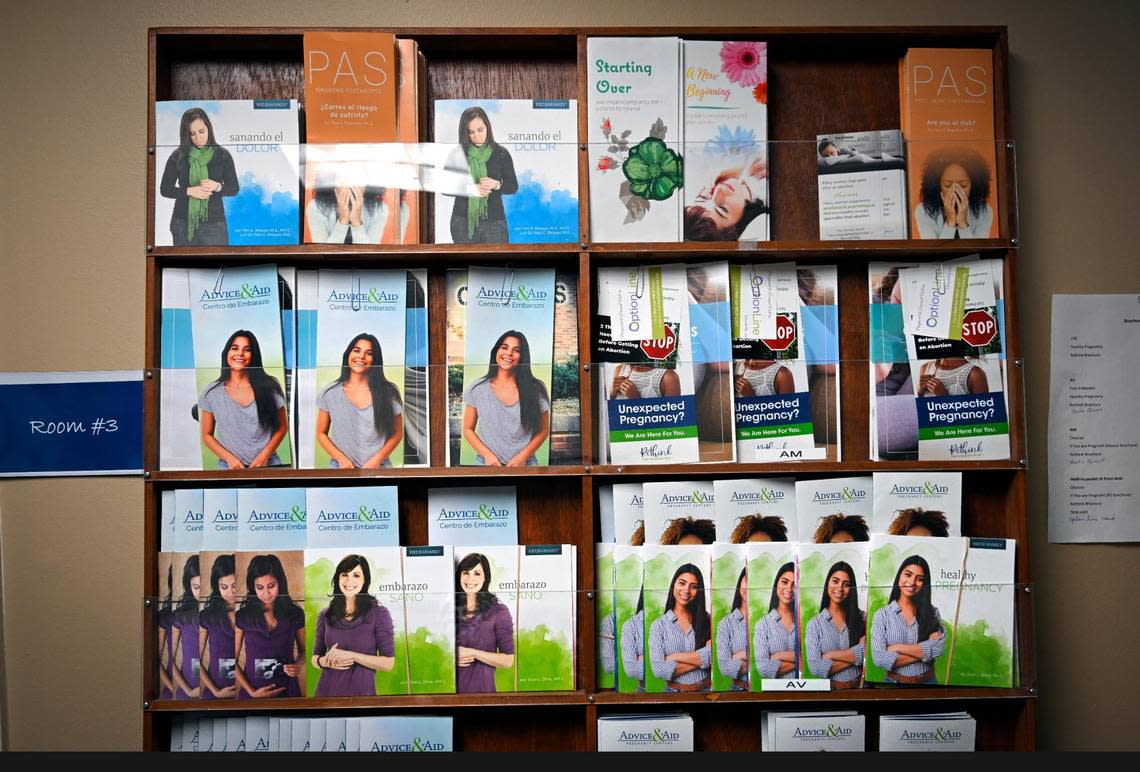 Brochures are on display outside a patient exam room at Advice & Aid Pregnancy Centers in Overland Park.