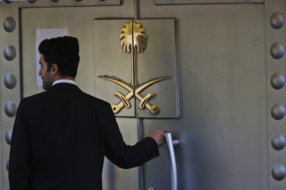A security guard prepares to enter Saudi Arabia's consulate in Istanbul, Friday, Oct. 26, 2018. The Saudi officials who killed journalist Jamal Khashoggi in their Istanbul consulate must reveal the location of his body, Turkey's President Recep Tayyip Erdogan said Friday in remarks that were sharply critical of the kingdom's handling of the case.(AP Photo/Lefteris Pitarakis)