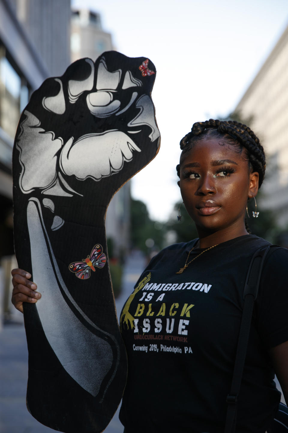 Joella Roberts, 22, of Washington, who is a recipient of the Deferred Action for Childhood Arrivals (DACA) program and is originally from Trinidad and Tobago, poses for a portrait, Friday, June 12, 2020, before leading a protest near the White House in Washington, over the death of George Floyd, a black man who died while in police custody in Minneapolis. Roberts, who founded her own non-profit called Migration Matters, spoke to people visiting the site of protests about immigration and racism. (AP Photo/Jacquelyn Martin)