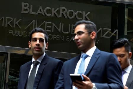 Men exit the the BlackRock offices in New York City, U.S., October 17, 2016. REUTERS/Brendan McDermid