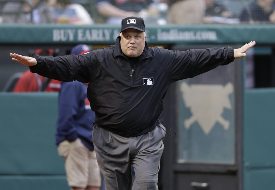 Umpire crew chief Brian O'Nora signals that Cleveland Indians' Michael Brantley was safe at second after a replay review on a double in the third inning of a baseball game against the Minnesota Twins Wednesday, May 7, 2014, in Cleveland. (AP Photo/Mark Duncan)