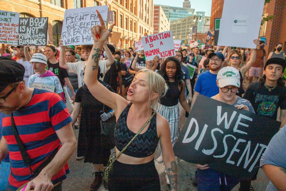 Abortion-rights protesters march through downtown Detroit following a rally at the Theodore Levin Federal Court building in Detroit to protest against the U.S. Supreme Court decision to overturn Roe v. Wade on June 24, 2022.