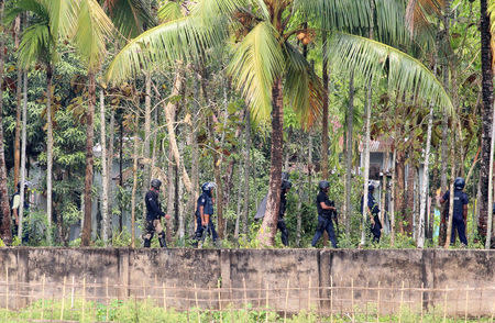 Security personnel get ready to raid a militant den in Nasirpur village, Moulvibazar, northeast of the capital Dhaka, Bangladesh, March 30, 2017. REUTERS/Stringer