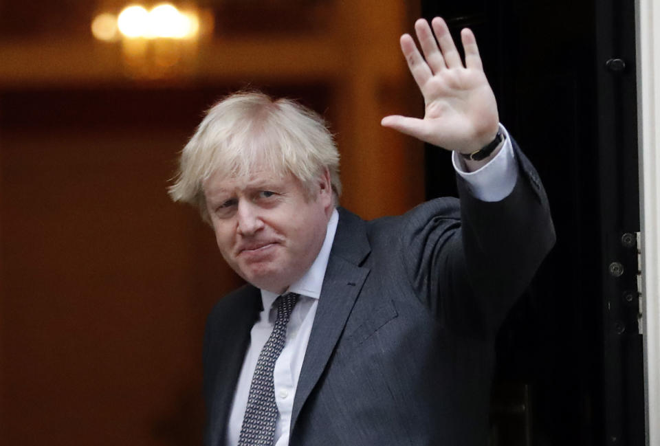 Britan's Prime Minister Boris Johnson arrives at 10 Downing Street in London, Wednesday, Dec. 30, 2020. The European Union's top officials have formally signed the post-Brexit trade deal with the United Kingdom, as lawmakers in London get set to vote on the agreement. European Commission president Ursula von der Leyen and European Council president Charles Michel put pen to paper on Wednesday morning during a brief signature ceremony in Brussels. (AP Photo/Frank Augstein)