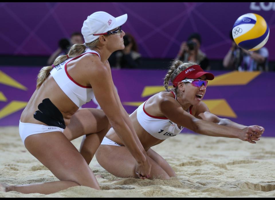 United States' Jennifer Kessy, left, looks on as April Ross, right, reaches for a ball during the women's gold medal beach volleyball match against the other US team at the 2012 Summer Olympics, Wednesday, Aug. 8, 2012, in London. 