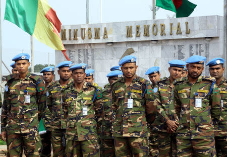 U.N. Peacekeepers from Bangladesh attend a memorial ceremony for their comrades, who were killed by an explosive device in northern Mali on Sunday, at the MINUSMA base in Bamako, Mali September 27, 2017. REUTERS/Moustapha Diallo