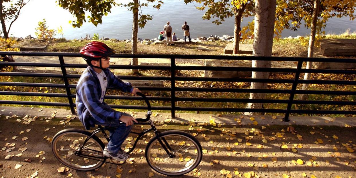 a bike path runs along the sacramento river in old sacramento state historic park