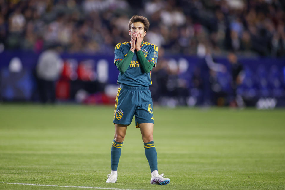 LA Galaxy midfielder Riqui Puig reacts after missing on a scoring opportunity against the Vancouver Whitecaps during the second half of an MLS soccer match in Carson, Calif., Saturday, March 18, 2023. (AP Photo/Ringo H.W. Chiu)