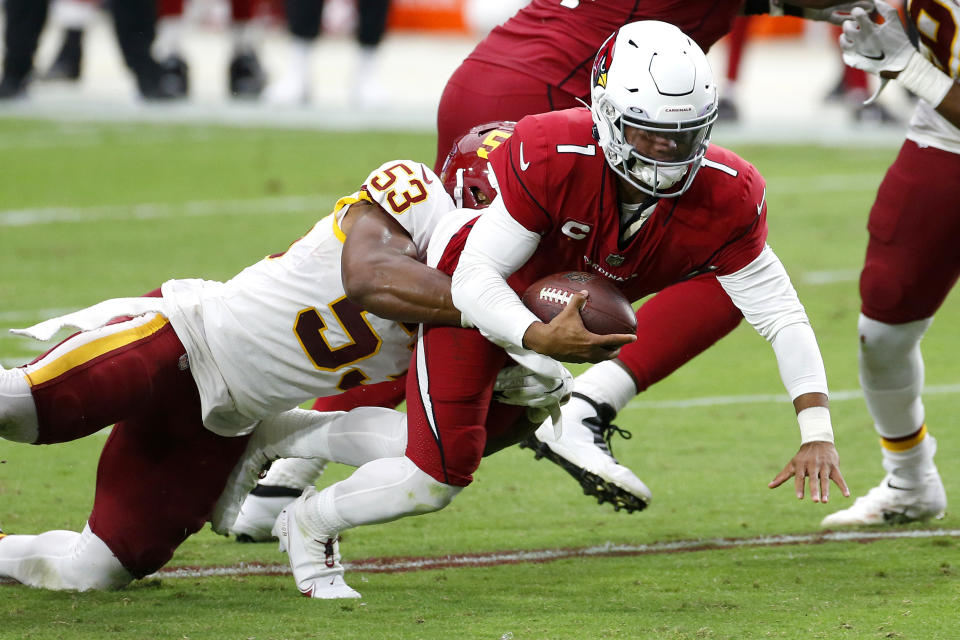 Arizona Cardinals quarterback Kyler Murray (1) is pulled down by Washington Football Team inside linebacker Jon Bostic (53) during the second half of an NFL football game, Sunday, Sept. 20, 2020, in Glendale, Ariz. (AP Photo/Darryl Webb)