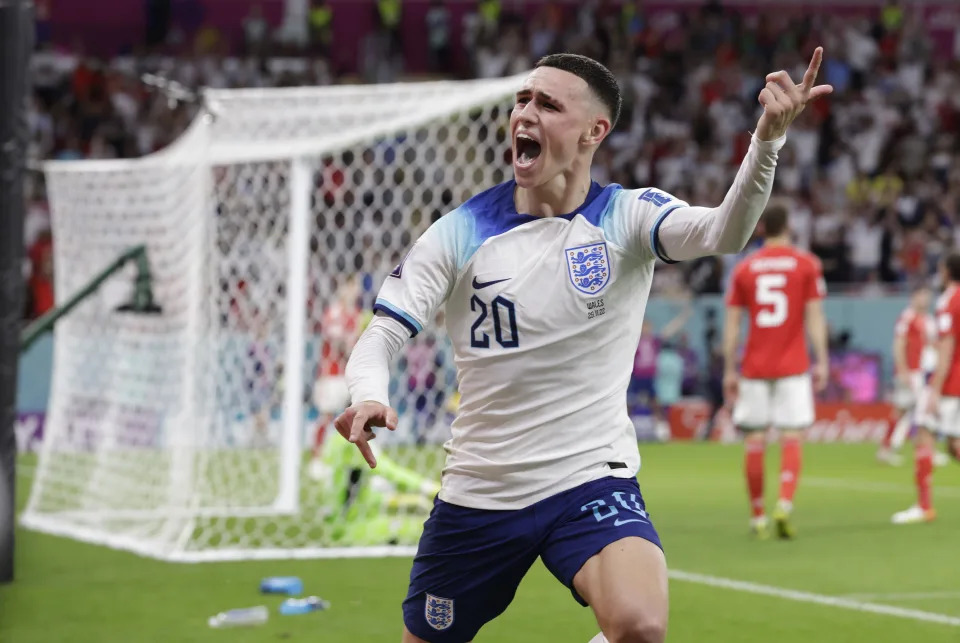 DOHA, QATAR - NOVEMBER 29: Phil Foden of England celebrates the second goal during the FIFA World Cup Qatar 2022 Group B match between Wales and England at Al Janoub Stadium on November 29, 2022 in Doha, Qatar. (Photo by Richard Sellers/Getty Images)