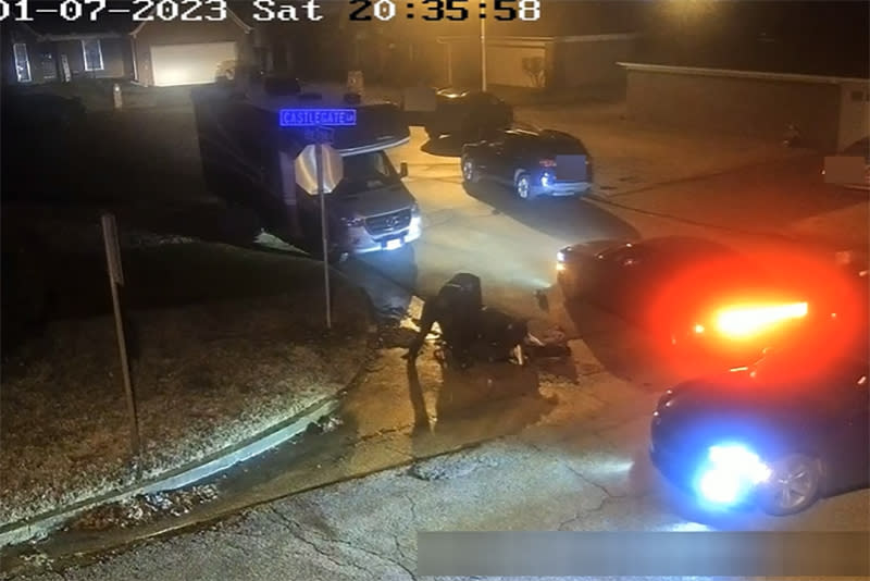 Memphis police officers surround Tyre Nichols as he lies on the ground on Jan 7. (City of Memphis)