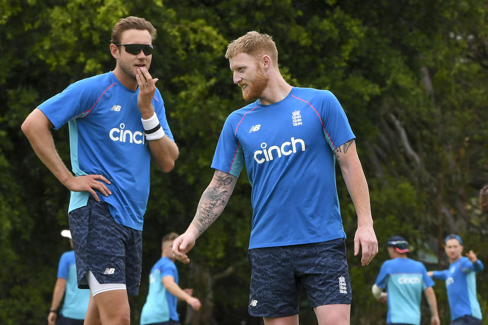 England's Ben Stokes, right, and Stuart Broad talk during a practice session on the first day of the Ashes tour match between England Men and England Lions, at Redlands Cricket Club, in Brisbane, Australia, Tuesday, Nov. 23, 2021. (Dave Hunt/AAP Image via AP)