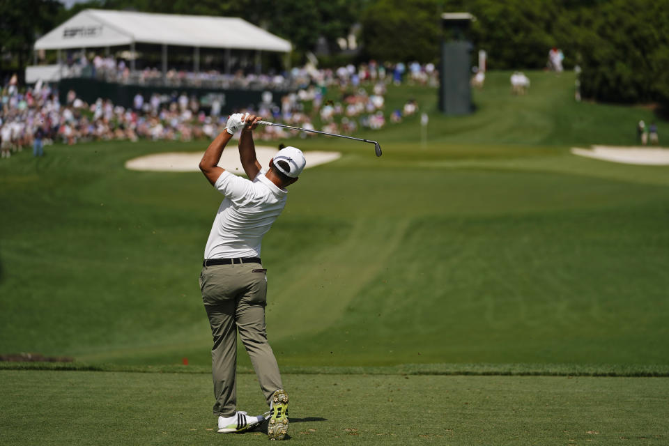 Xander Schauffele watches his tee shot on the 13th hole during the second round of the Wells Fargo Championship golf tournament at Quail Hollow on Friday, May 10, 2024, in Charlotte, N.C. (AP Photo/Erik Verduzco)