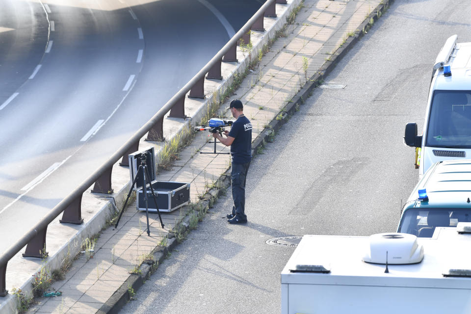 19 August 2020, Berlin: An investigator is preparing a drone on the Berlin city highway A100 near the exit Alboinstraße. The State Security is investigating a man who caused the city highway to be closed for hours and was carrying an alleged ammunition box. According to initial findings, the driver had previously caused several accidents and then announced that the box contained a "dangerous object", a police spokeswoman said during the night. Photo: Paul Zinken/dpa-Zentralbild/dpa (Photo by Paul Zinken/picture alliance via Getty Images)